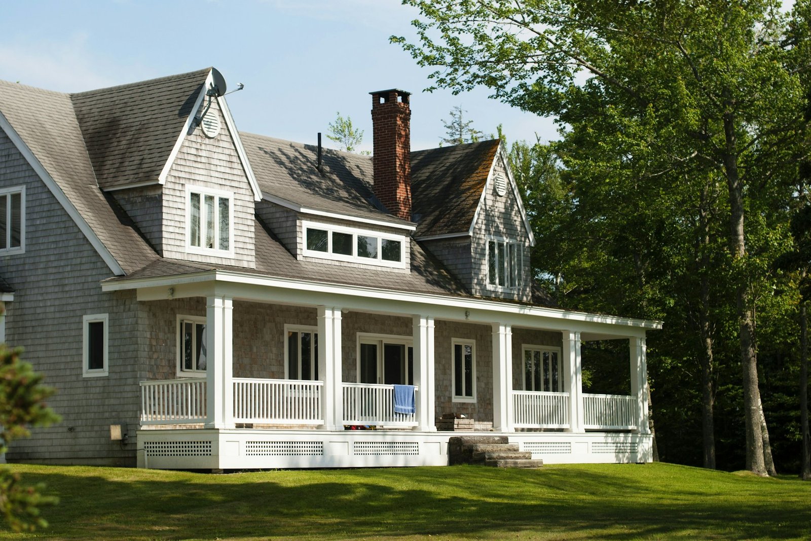 A welcoming home surrounded by green trees